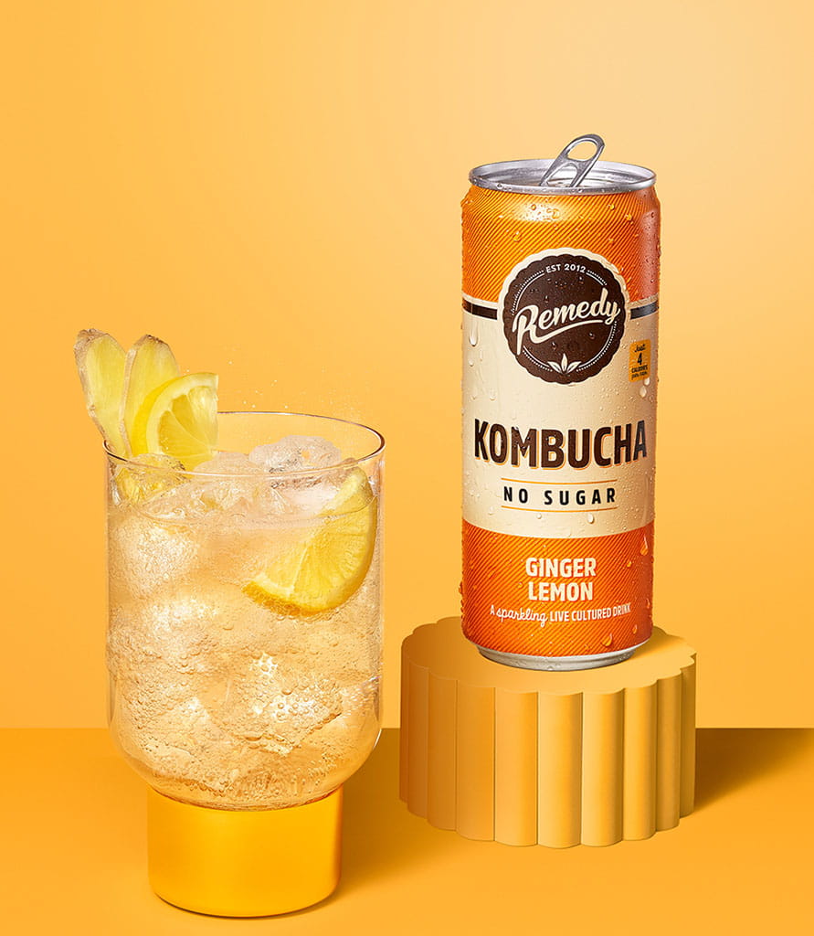 Remedy Kombucha Ginger Lemon with glass Lifestyle