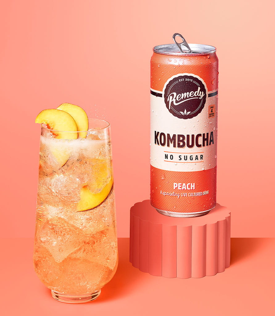 Remedy Kombucha Peach with glass Lifestyle