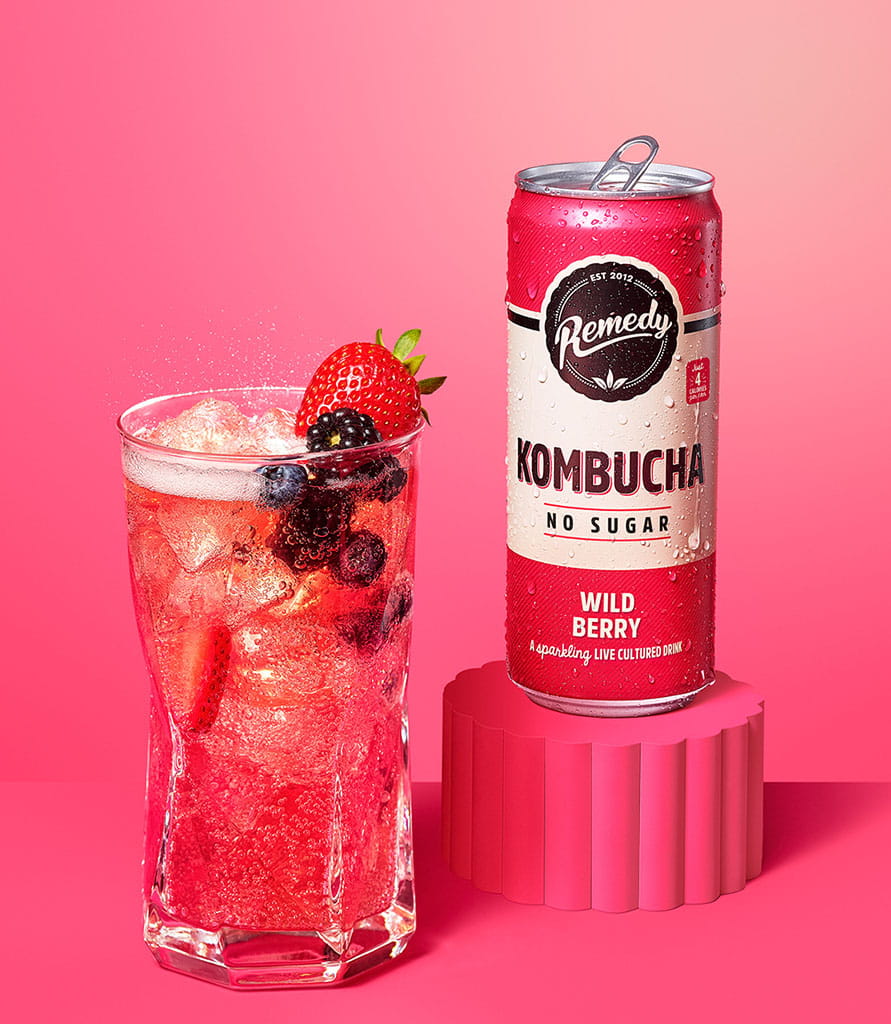 Remedy Kombucha Wild Berry with glass